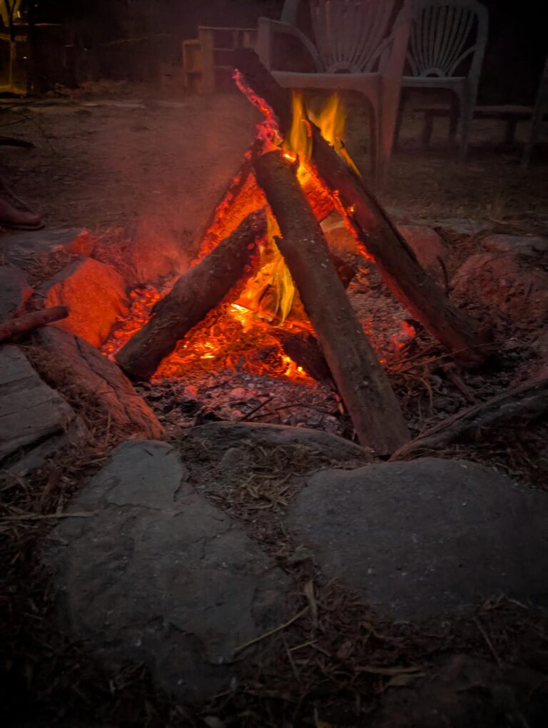 Campfire burning outdoors at Valle de Sensaciones